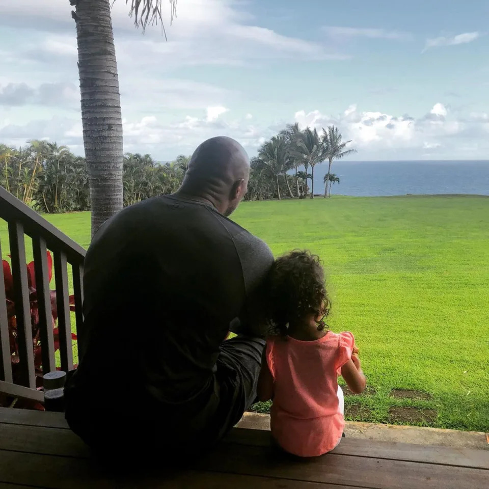 The Rampage star took in a quiet moment with daughter Tiana on the back porch of their Hawaii home in May 2021.