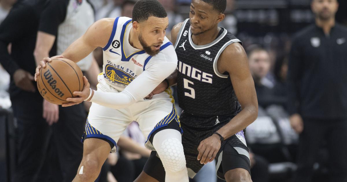 Fox leads Kings past Warriors 126-123 in playoff return