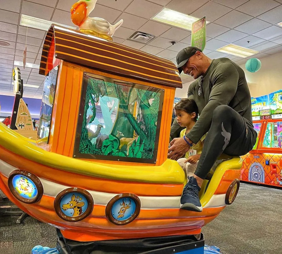 The family celebrated Jasmine's half-birthday with a bash at Chuck E. Cheese in July 2021. The San Andreas star shared a photo of himself atop a very small boat ride with his daughter. "We all had an AWESOME time and as you can see here my 270lbs completely dislodged this poor little boat off its happy hydraulic hinges," he joked via Instagram. "Sorry, Chuckee [sic], we're gonna need a bigger boat and thanks for the pizza and ice cream for breakfast."
