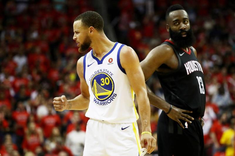 HOUSTON, TX - MAY 28: Stephen Curry #30 of the Golden State Warriors reacts as James Harden #13 of the Houston Rockets looks on in the third quarter of Game Seven of the Western Conference Finals of the 2018 NBA Playoffs at Toyota Center on May 28, 2018 in Houston, Texas. NOTE TO USER: User expressly acknowledges and agrees that, by downloading and or using this photograph, User is consenting to the terms and conditions of the Getty Images License Agreement.
