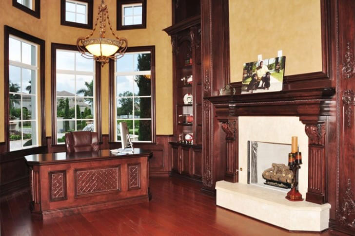 The Rock's office boasts a mahogany desk and impressive fireplace